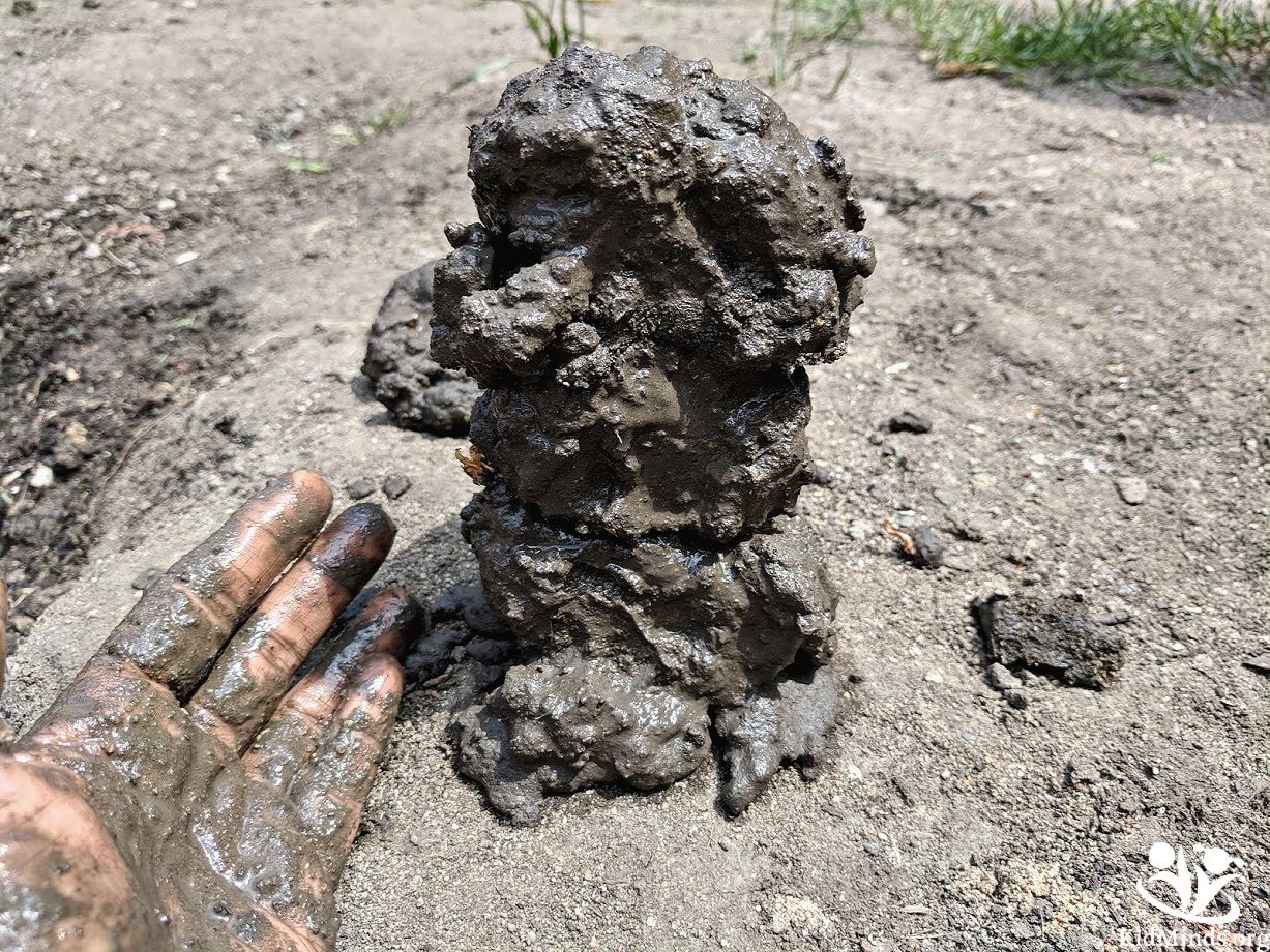 Childhood has changed, and activities like playing with mud don’t seem to make anyone’s summer bucket list these days. Get kids back outside for old-fashioned fun with nature and invite them to make sturdy mud sculptures. #mud #sensoryplay #summer #handsonlearning #kidminds #laughingkidslearn #outdoorfun #homeschooling