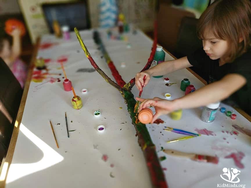 Painted tree stick is a process art and creative experimentation. It's colorful, easy, and fun for kids of all ages and their parents to do together.   #elementaryart #artprojects #artprojectsforkids #kidscreate #kidart #handsonlearning #funathomewithkids #kidminds #summeractivities #processart #natureinspired