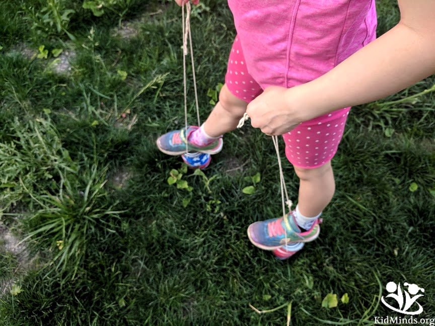 Stilt-walking is a great way to burn energy and have fun outside this summer. All you need are two cans of tomatoes and a rope. You can go all out and decorate the cans as we did. #summer #outdoorfun #stiltwalking #kidactivities #energyburners #kids #activekids #formoms #boredombusters #4thofjulycraft